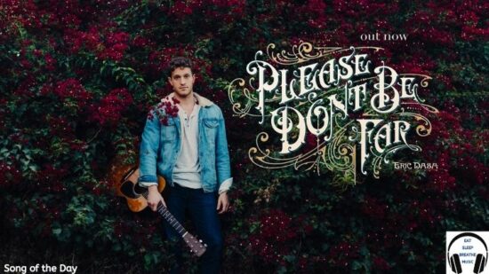 White Man Eric Dash with a blue jacket and guitar standing against bushes with words "please don't be far" song of the day feature | Eat Sleep Breathe Musice