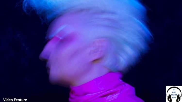 Helinksi Woman GEA with Blond Hair wearing a pink turtleneck | Video Feature | Eat Sleep Breathe Music