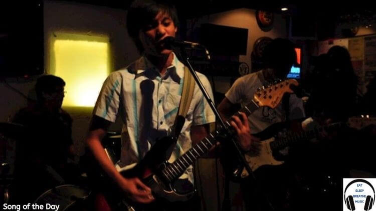 Asian Man Playing the Guitar Optacure Song of the Day | Eat Sleep Breathe Music