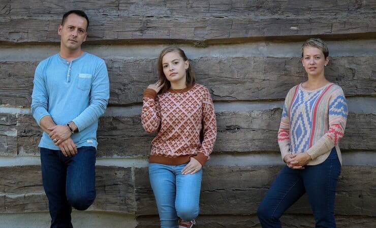 Shannon Clark & The Sugar Gang A white man in a blue shirt with a white little girl and a white woman next to her| Eat Sleep Breathe Music