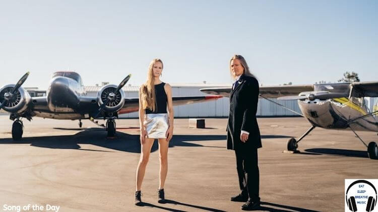 White woman and White man standing on front of private planes |Sluka Tonight You Belong to Me Song of the Day| Eat Sleep Breathe Music