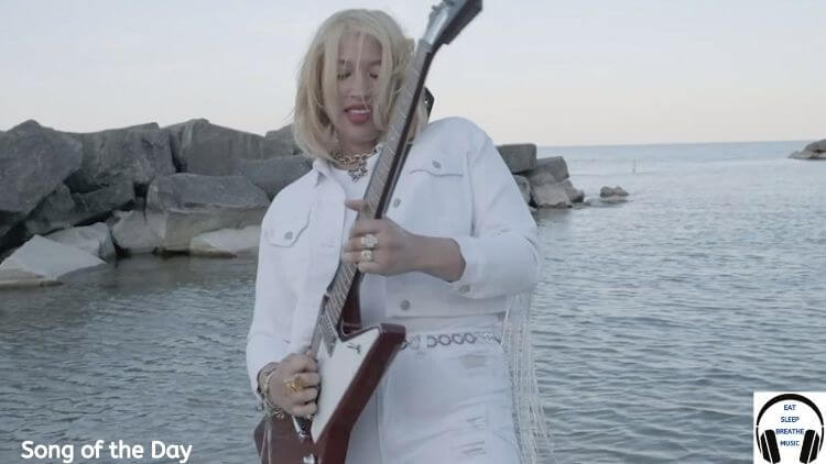 Musician Blake Red Holding a Guitar | Eat Sleep Breathe Music