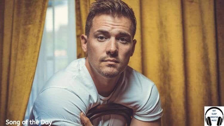 Musician Davis Mallory sitting backwards on a chair | Eat Sleep Breathe Music