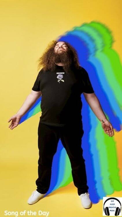 TOIGO Musician Standing in Front of a Yellow background | Eat Sleep Breathe Music