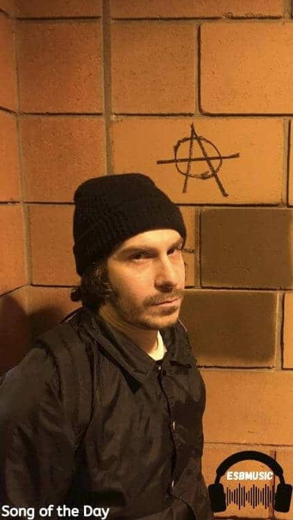 Brooklyn Sickpay in front of a tiled walled | Generosity Song feature | Eat Sleep Breathe Music