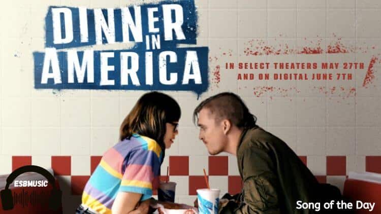 Song of the Day "Watermelon" from the Motion Picture Dinner In America Actress Emily Skeggs and Kyle Gallner in front of a tiled wall looking at each other | Eat Sleep Breathe Music