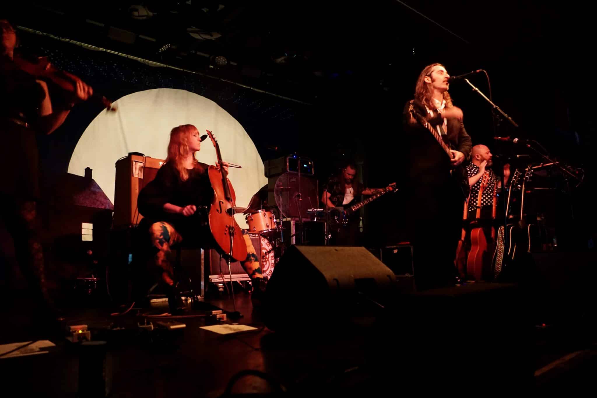 Members of the band Murder by Death on Stage at Asbury Lanes in Asbury Park, NJ Adam Turla, cellist Sarah Balliet, percussionist Alexander Schrodt, keyboardist Vincent Edwards, and bassist Matt Armstrong | Show Review | Eat Sleep Breathe Music |